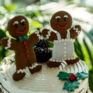 Gingerbread bride and groom cookies atop a winter wedding cake at Gettysburg Battlefield Bed and Breakfast Inn and Wedding Venue in South Central Pennsylvania.